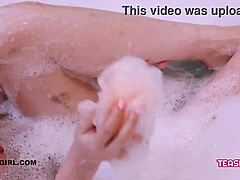 Young and seductive girl indulges in a steamy bath