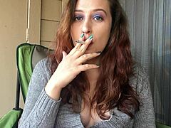 Sensual smoking fetish with a cute and kinky goddess in tight sweater