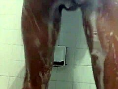 Slim and sexy ebony performer gets wet in the shower