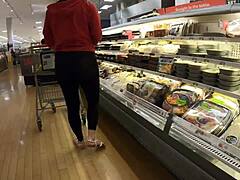 Gorgeous brunette reveals her curves in transparent leggings at the grocery store